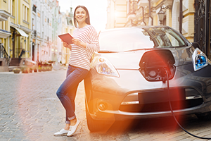 woman-charging-electric-vehicle